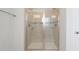 Large walk-in shower with glass doors and built-in seat at 2557 Pete Dye Dr. # 1102, North Myrtle Beach, SC 29582