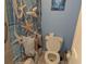 Bathroom with toilet and seashell shower curtain at 2611 Ocean Blvd. S # 305, Myrtle Beach, SC 29577