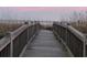 Wooden boardwalk leads to sandy beach at 2611 Ocean Blvd. S # 305, Myrtle Beach, SC 29577