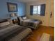 Bright bedroom featuring two twin beds at 2611 Ocean Blvd. S # 305, Myrtle Beach, SC 29577