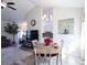 Bright dining area with a wooden table and four chairs, adjacent to the kitchen at 262 Ole Maple St., Loris, SC 29569