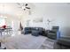 Spacious living room with gray sectional sofa and large TV at 262 Ole Maple St., Loris, SC 29569