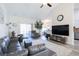 Open concept living room featuring a sectional sofa and access to a screened porch at 262 Ole Maple St., Loris, SC 29569