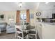 Dining area with round table and chairs near kitchen at 2801 S Ocean Blvd. S # 241, North Myrtle Beach, SC 29582