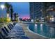 Evening view of resort pool and numerous lounge chairs at 2801 S Ocean Blvd. S # 241, North Myrtle Beach, SC 29582