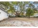 Large backyard with mature trees and shed at 316 N Highland Ave., Myrtle Beach, SC 29577