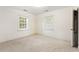 Well-lit bedroom with neutral walls and carpeting at 316 N Highland Ave., Myrtle Beach, SC 29577