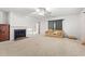 Bright living room featuring a fireplace and neutral carpeting at 316 N Highland Ave., Myrtle Beach, SC 29577