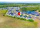 An aerial view of a beautiful neighborhood with a pond and fountain, surrounded by lush greenery at 352 High Falls Dr., Conway, SC 29526