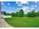 Expansive backyard features lush green lawn and perimeter privacy fence, offering ample space for outdoor activities at 352 High Falls Dr., Conway, SC 29526