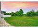 Expansive backyard features lush green lawn and perimeter privacy fence, offering ample space for outdoor activities at 352 High Falls Dr., Conway, SC 29526