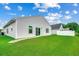 Spacious, well-maintained backyard with verdant lawn provides a private outdoor area for relaxation and recreation at 352 High Falls Dr., Conway, SC 29526