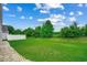 Fenced backyard with grassy lawn and rock pathway at 352 High Falls Dr., Conway, SC 29526