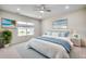 Bright bedroom featuring a ceiling fan, beach-themed wall art, and comfortable bed with blue accents at 352 High Falls Dr., Conway, SC 29526
