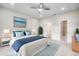 Comfortable bedroom with a ceiling fan, beach-themed wall art, and cozy bed with blue accents at 352 High Falls Dr., Conway, SC 29526