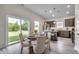 Charming dining area with wood table, slider doors, and easy access to the kitchen offers a cozy, inviting space at 352 High Falls Dr., Conway, SC 29526