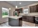 Modern kitchen with dark cabinets, granite countertops, and stainless steel appliances at 352 High Falls Dr., Conway, SC 29526