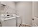 Laundry room with washer and dryer and wire shelving at 352 High Falls Dr., Conway, SC 29526