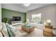 Bright living room with white sofas and green accent wall at 352 High Falls Dr., Conway, SC 29526