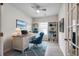 Bright office space with built-in shelving, sleek desk, blue chair and modern finishes offers a comfortable work environment at 352 High Falls Dr., Conway, SC 29526