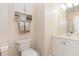 Bathroom with toilet, vanity, and built in shelving at 402 Ocean Pointe Ct., North Myrtle Beach, SC 29582