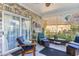 Relaxing screened porch with comfortable seating and tiled floor at 402 Ocean Pointe Ct., North Myrtle Beach, SC 29582