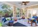 Relaxing screened porch with rocking chairs and outdoor seating at 402 Ocean Pointe Ct., North Myrtle Beach, SC 29582