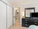 Bedroom provides an ensuite bathroom, neutral walls, and ample space for storage in the dresser at 4384 Daphne Ln. # H, Murrells Inlet, SC 29576