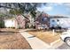Inviting brick and siding condo with a well-maintained lawn and sidewalk leading to the entrance at 4384 Daphne Ln. # H, Murrells Inlet, SC 29576