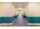 Building interior hallway with teal and white walls at 4384 Daphne Ln. # H, Murrells Inlet, SC 29576