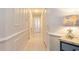 Light and airy hallway with neutral wall colors and wood-look flooring at 4384 Daphne Ln. # H, Murrells Inlet, SC 29576