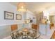 Well-equipped kitchen with white cabinets and glass top table at 4384 Daphne Ln. # H, Murrells Inlet, SC 29576