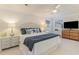 Spacious main bedroom with a king-size bed, TV, and ample natural light at 4384 Daphne Ln. # H, Murrells Inlet, SC 29576