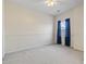 Bright bedroom with neutral walls, carpet, and a window with blue curtains at 4432 Montrose Ln. # H, Myrtle Beach, SC 29579