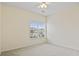 Well-lit bedroom featuring neutral walls, carpet, and a large window at 4432 Montrose Ln. # H, Myrtle Beach, SC 29579