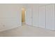 Spacious bedroom with neutral walls, carpet, and double-door closet at 4432 Montrose Ln. # H, Myrtle Beach, SC 29579