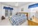 Spacious bedroom with a king-size bed and blue bedding at 4434 Little River Inn Ln. # 205, Little River, SC 29566