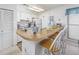 Efficient kitchen with light wood countertops and white cabinets at 4434 Little River Inn Ln. # 205, Little River, SC 29566