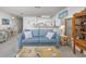 Cozy living room featuring a blue couch and a light wood coffee table at 4434 Little River Inn Ln. # 205, Little River, SC 29566