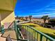 Balcony with patio furniture and partial ocean view at 4505 S Ocean Blvd. S # 1-E, North Myrtle Beach, SC 29582