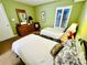 Bedroom with two twin beds and dresser at 4505 S Ocean Blvd. S # 1-E, North Myrtle Beach, SC 29582