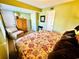 Bedroom with king-size bed and sitting area at 4505 S Ocean Blvd. S # 1-E, North Myrtle Beach, SC 29582