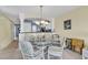 Charming dining area with glass table and wicker chairs at 4625 Lightkeepers Way # 7-H, Little River, SC 29566