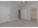 Spacious bedroom with carpet, double doors to en-suite bathroom, and ample closet space at 4887 Luster Leaf Circle # 404, Myrtle Beach, SC 29577