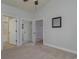 Well-lit bedroom with mirrored closet doors and access to bathroom at 4887 Luster Leaf Circle # 404, Myrtle Beach, SC 29577