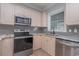 Modern kitchen with stainless steel appliances and granite countertops at 4887 Luster Leaf Circle # 404, Myrtle Beach, SC 29577