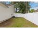 Private fenced backyard featuring a lawn and an air conditioning unit at 5933 Rahnavard Blvd., Myrtle Beach, SC 29588