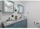 Stylish bathroom featuring dual sinks, granite counters, decorative mirrors and black faucet fixtures at 5933 Rahnavard Blvd., Myrtle Beach, SC 29588