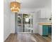 Dining area with sliding glass doors and modern light fixture at 5933 Rahnavard Blvd., Myrtle Beach, SC 29588