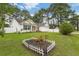 Attractive home with a well-kept lawn, garden beds, and a white picket fence at 5933 Rahnavard Blvd., Myrtle Beach, SC 29588